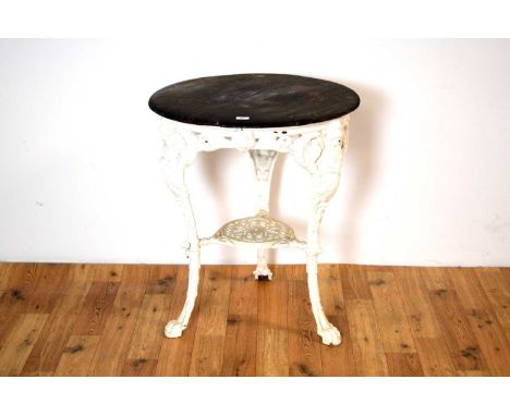 A vintage cast iron 'Britannia' pub table, the circular top with chamfered edge, above a foliate and pierced frieze, raised o