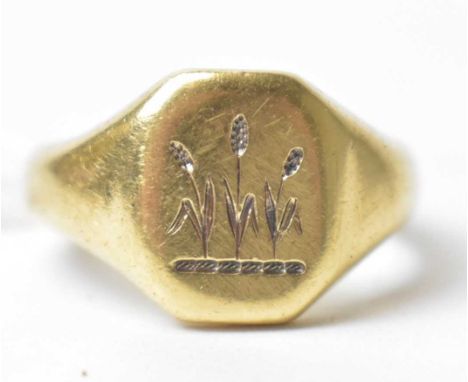An 18ct yellow gold signet ring, the matrix engraved with three sheaths of corn, ring size M, 12.1g.