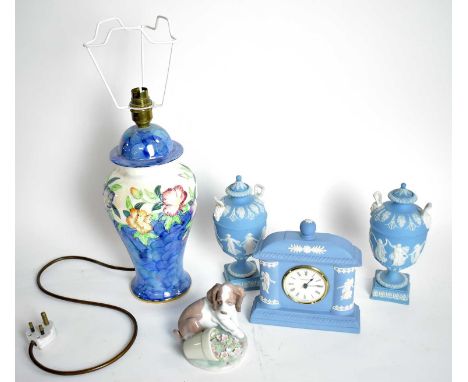 A Wedgwood Jasperware miniature mantel clock, with a pair of Wedgwood Jasperware twin handled urn vase garnitures; together w