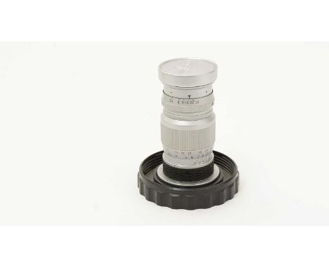 An Elmar 9cm f4 lens by Leitz, bayonet-fit with UVa filter and lens-cap, in original perspex case.