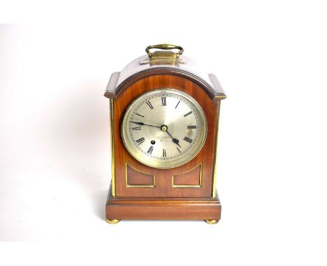 A Victorian dome cased mantel clock, by R &amp; W Sorley, Glasgow, with brass handle and bun feet, 39cms high (including hand