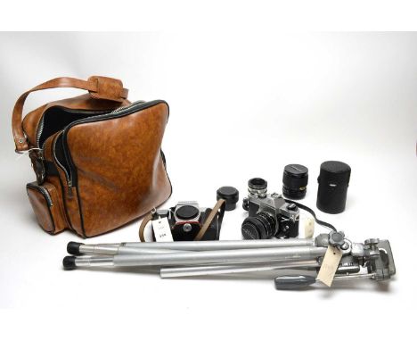 A collection of cameras and camera equipment, including: a Velbon Super Pro tripod; a Pentacon Praktica camera; a Canon Canol