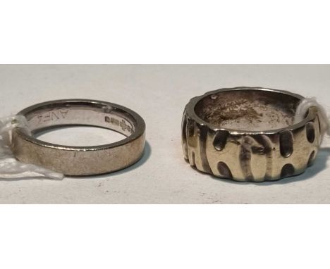 A 9ct white gold wedding band of matte design, ring size L; together with a white gold wedding band with shaped decoration, r