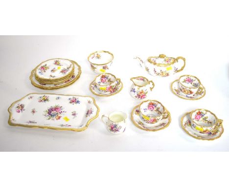 A Hammersley ‘Dresden Sprays’ pattern tea service, comprising: a tea pot; four tea trios; a cream jug; a sugar bowl; and two 