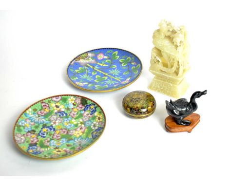 Two Chinese cloisonné enamel circular plates, variously decorated with flowering foliage, each 20cms diameter; together with 