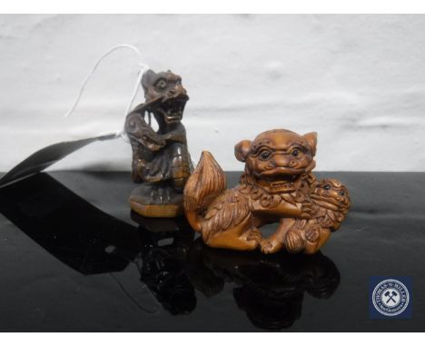 Two carved fruitwood netsuke