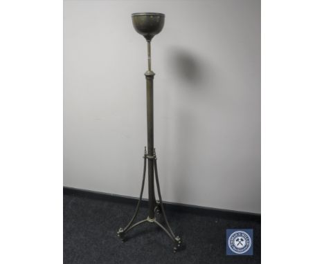 An antique brass rise and fall standard lamp base 