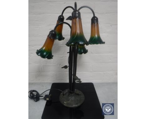 A contemporary metal five way table lamp with coloured glass fluted shades 