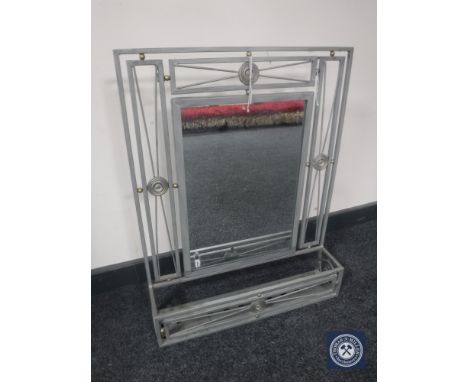 A metal framed mirror with shelf 