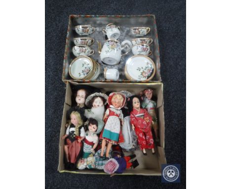 A box of twentieth century dolls of the world, boxed miniature Japanese tea service