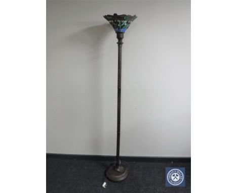 A contemporary metal standard lamp with Tiffany style shade 