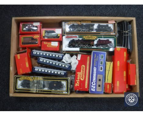 A box of assorted railway rolling stock and track including Mainline 00 gauge engine and wagons, Lima coaches etc 