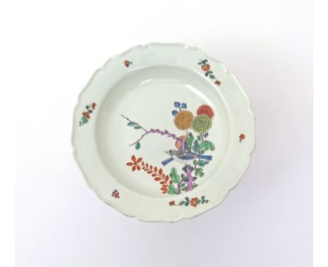 A rare Worcester plate c.1765, after Meissen, painted in Kakiemon type colours with two birds perched on a purple-stemmed bra