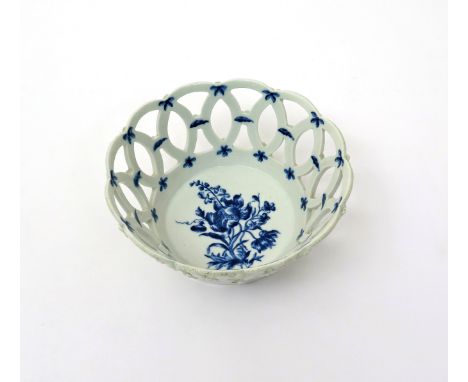 A rare Worcester blue and white basket  c.1762, the circular form painted to the interior with the Anemone and Bellflower Spr