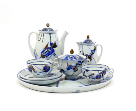 A Russian Soviet porcelain tête à tête service  c.1931, Lomonosov Factory, richly decorated with an abstract pattern in blue,