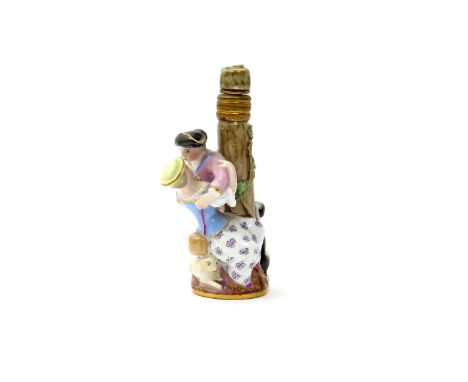 A Meissen scent bottle  19th century, modelled as couple embracing beside a tree trunk, a lamb and dog seated beside, the met