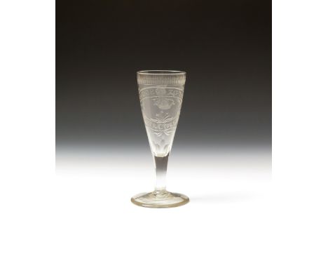 A rare wine glass or champagne flute of coal-mining interest  c.1780, the tapering bowl finely cut with an ovolu border benea