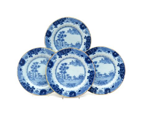 Four Irish delftware plates  c.1750, painted in blue after a Chinese design, each with two fallow deer beside flowering bushe