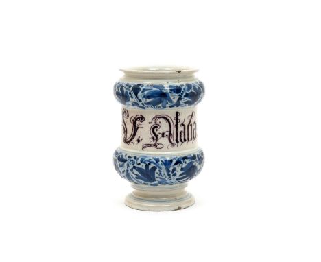 An Italian maiolica albarello  mid 18th century, the dumbell form titled in manganese script with 'U. Alabastrium', between b