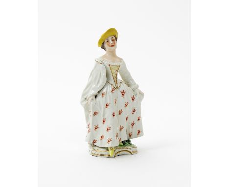 A Frankenthal figure of a lady  c.1765, holding the edges of her wide skirt in both hands, wearing a white cloak draped over 