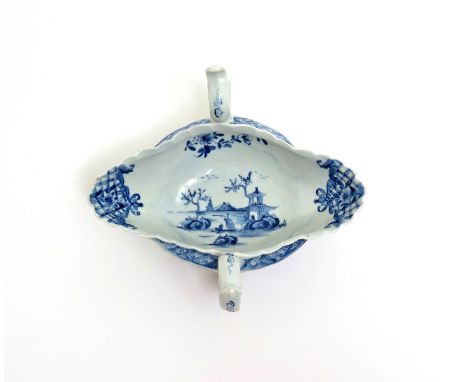 A Worcester blue and white two-handled sauceboat   c.1755-60, painted to the interior with the Two-Handled Sauceboat Landscap