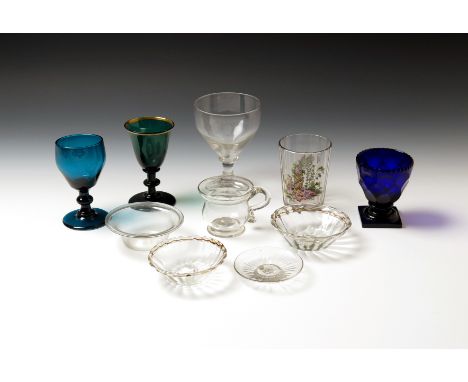 A small collection of glass items  18th century and later, including three small bowls with folded rims, a moulded patch stan