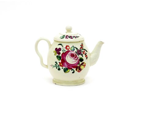 A creamware teapot and cover  c.1780, the small rounded form brightly enamelled with a spray of flowers including rose and he