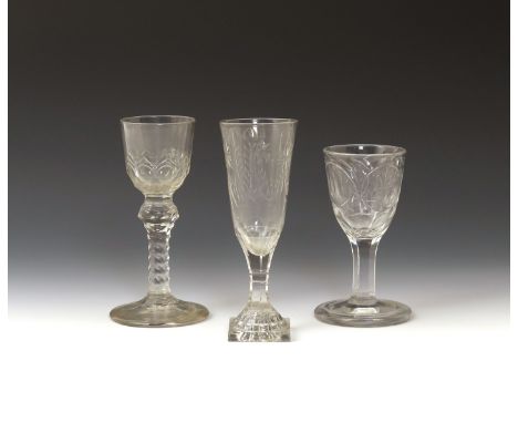 Three wine glasses  late 18th/early 19th century, with variously cut round funnel bowls with formal and floral designs, two r