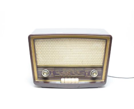 A vintage Stella MK 40121 radio, in burgundy Bakelite case, 45 x 31cms high.