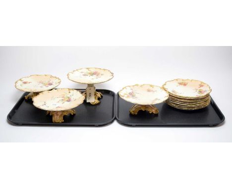 A Royal Worcester blush ivory dessert service, decorated with floral bouquets, comprising: four pedestal cake stands; and nin