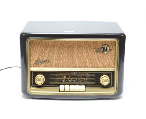 A vintage Bush VHF61 valve radio, in brown Bakelite case, 41 x 29cms high.