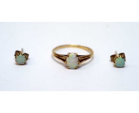 A single stone opal dress ring, in 9ct yellow gold mount and shank, ring size P; together with a pair of opal and 9ct yellow 