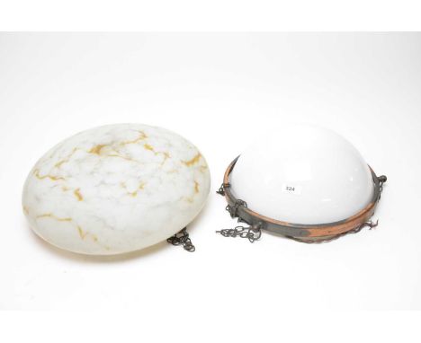 A vintage mottled glass ceiling light shade, with chain supports, 37cms diameter; together with another frosted glass ceiling