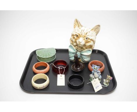 A selection of Art Deco collectibles, including: Ellgreaves cat money bank; five various bangles; Bakelite darning mushroom; 