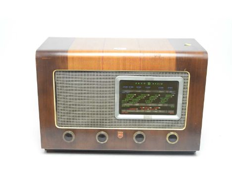 An Ekco vintage radio, model U109, in walnut case, 50 x 33cms high. 