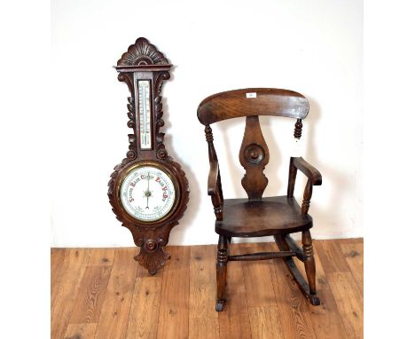 A 20th Century Oak framed wheel aneroid barometer, with central dial and thermometer above, 87cm high together with a beech a