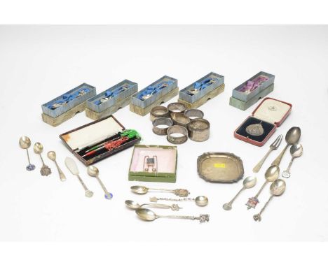 A selection of silver items, to include: teaspoons with dog finials, enamel finials and others; napkin rings; a Horse Associa