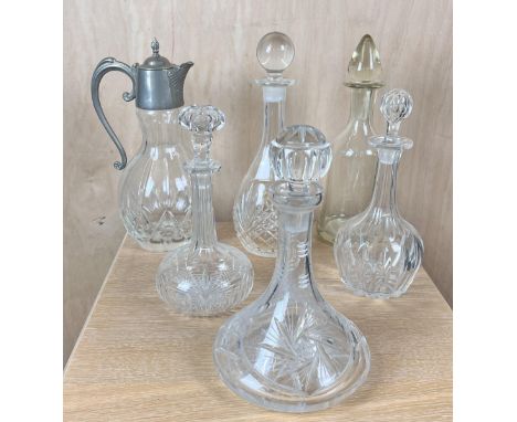 A collection of five 19th century and later cut glass decanters with stoppers along with a silver plated water jug. H.14cm 