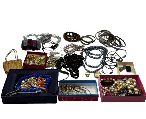 A collection of costume and bead jewellery, white metal bangles etc. 