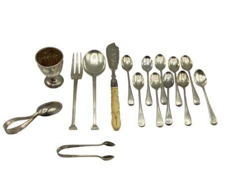 A collection of sterling silver items to include egg cup, caddy spoon, tea spoons, a spoon and fork by Ernest Arthur Jacob et