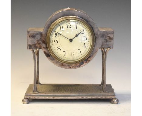 Early 20th Century silver plated mantel clock raised on four slender naturalistic pillars on a square hammered plinth with ba