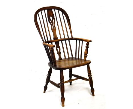 19th Century ash framed stick back Windsor elbow chair raised on turned supports, united by a stretcher   Condition: 