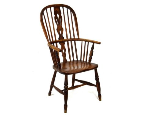 19th Century ash framed stick back Windsor elbow chair raised on turned supports, united by a stretcher   Condition: 