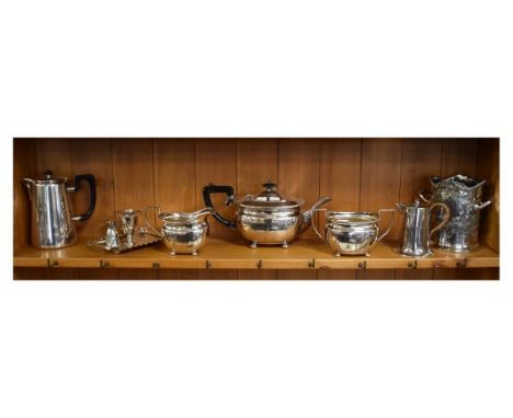 Selection of plated wares, to include; chamber candlestick with leaf handle and snuffer, a three piece tea service, wine bott