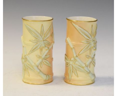 Pair of Royal Worcester cylindrical vases formed as bamboo stems in blush with gilt highlights having puce back stamp number 