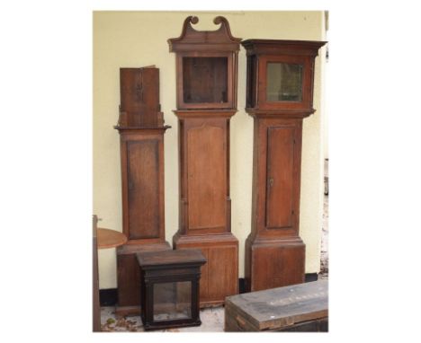 Group of late 18th/early 19th Century clock case parts comprising: mahogany crossbanded oak trunk and base, late 18th Century