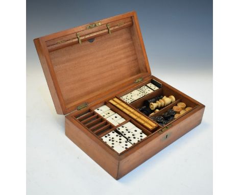 Victorian walnut cased games compendium containing two sizes of dominoes, cribbage marker board, chess pieces and draughts, t