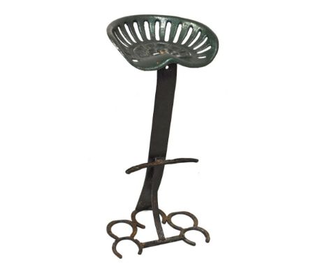 Bamlett tractor seat in green painted metal finish on wrought iron stand with horseshoe base   Condition: 