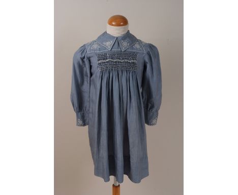 A C19TH SILK CHILD'S SMOCK Delicate and light silk dress in blue with silk floss hand embroidered and smocked on both front a