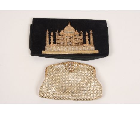 A DIAMANTE EVENING BAG Heavy with diamantes laced together over a cream satin liner. Clasped with gold metal, small gold chai
